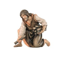 SI Herdsman kneeling withwood