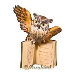 Flyinf owl on books